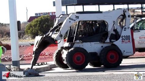 skid steer with rock dildo hammer|300.